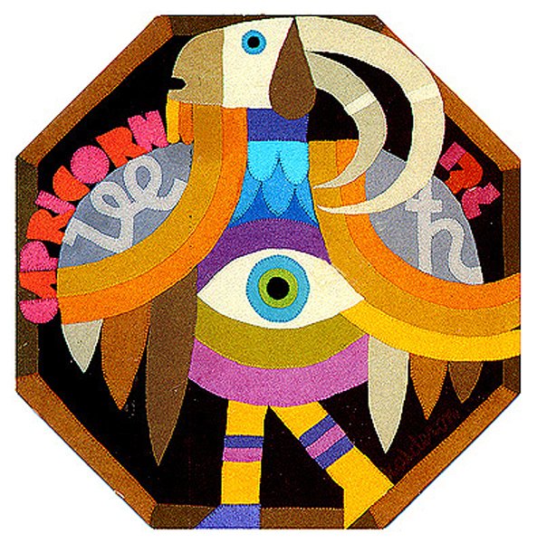 Tapestry 'Zodiacs Capricorn': an octagonal design of a stylised bird-goat creature with a large eye, in brown, orange and teal tones.